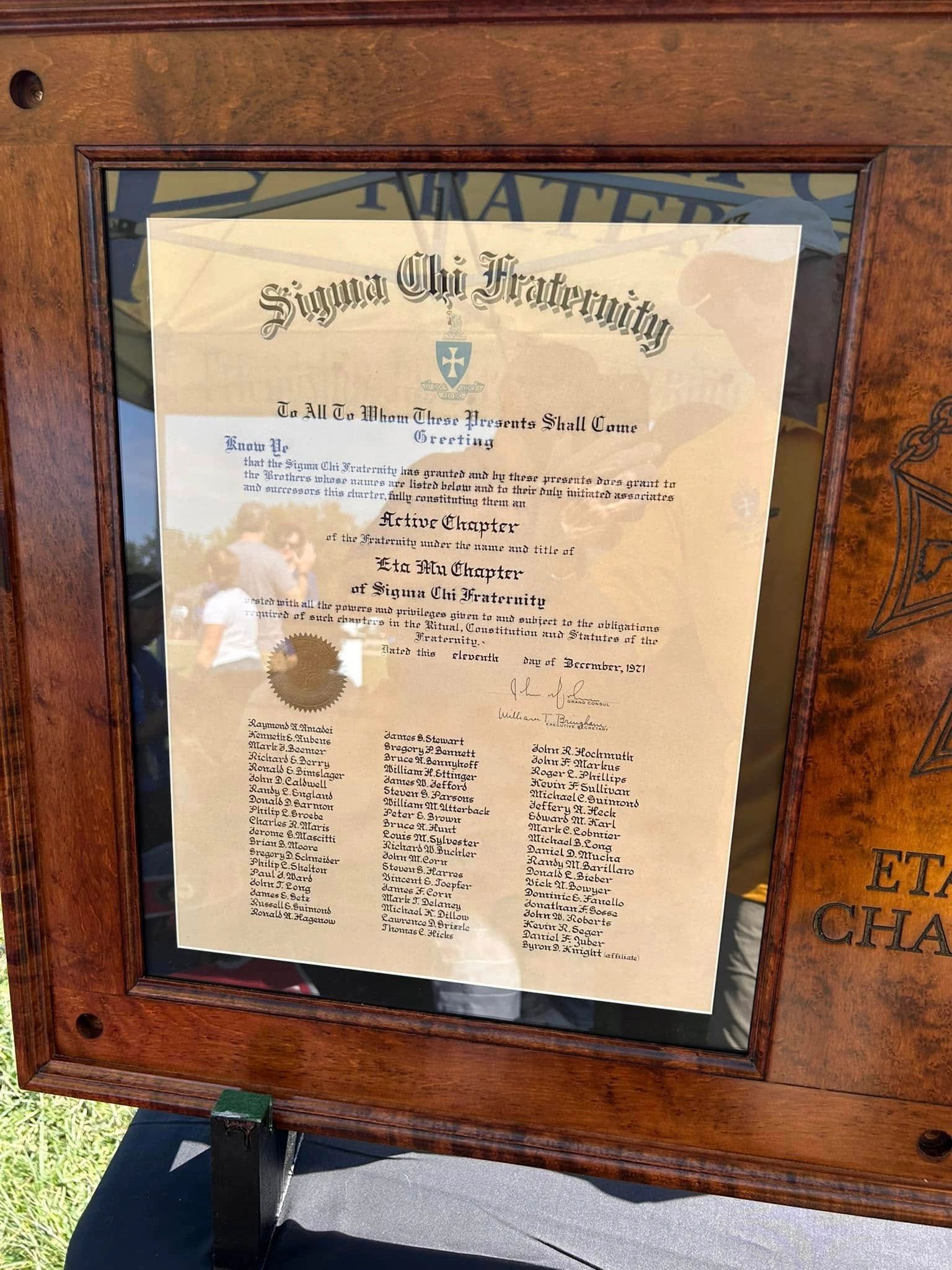 Framed Eta Mu charter showing the founding members' names