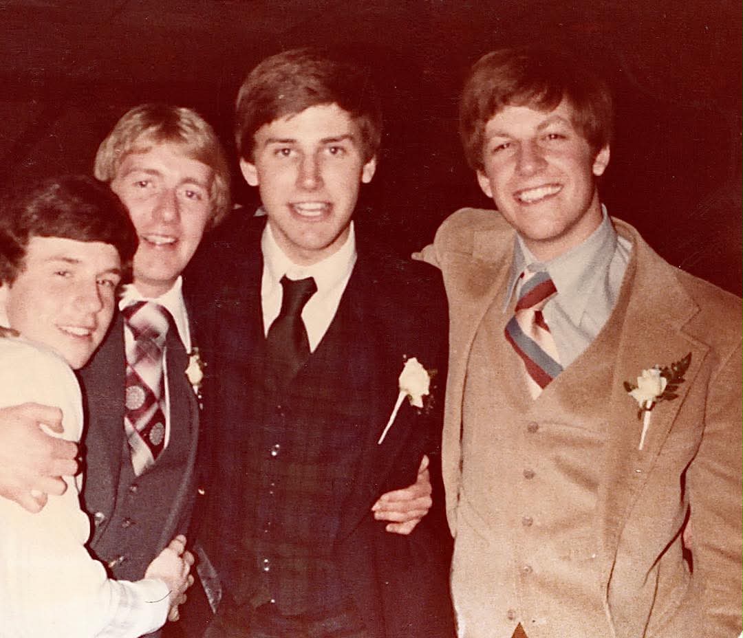 Four Eta Mu brothers dressed for a formal event