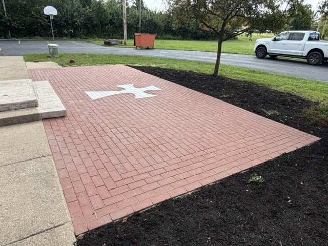 Recognition Patio at 2103 with the White Cross in the brickwork